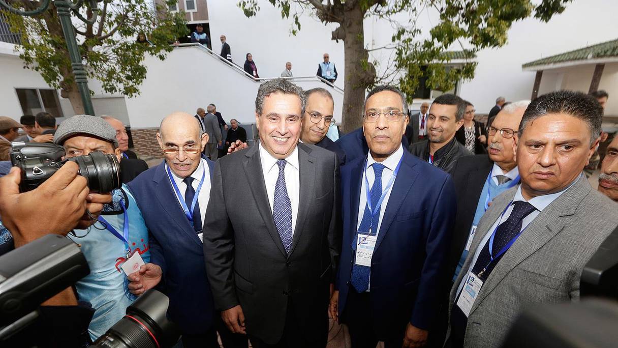 صورة من الأرشيف -  الأمين العام للاتحاد المغربي للشغل الميلودي موخاريق، رفقة رئيس الحكومة عزيز أخنوش